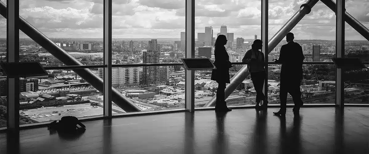 Businesspeople looking out over a city skyline