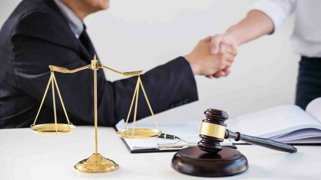 An immigration lawyer shaking hand with an E2 visa applicant