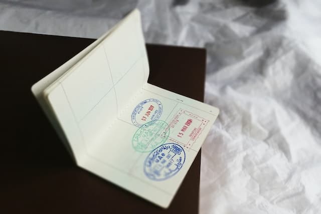 Stamps of immigration stamps for various countries in an E2 visa holder passport