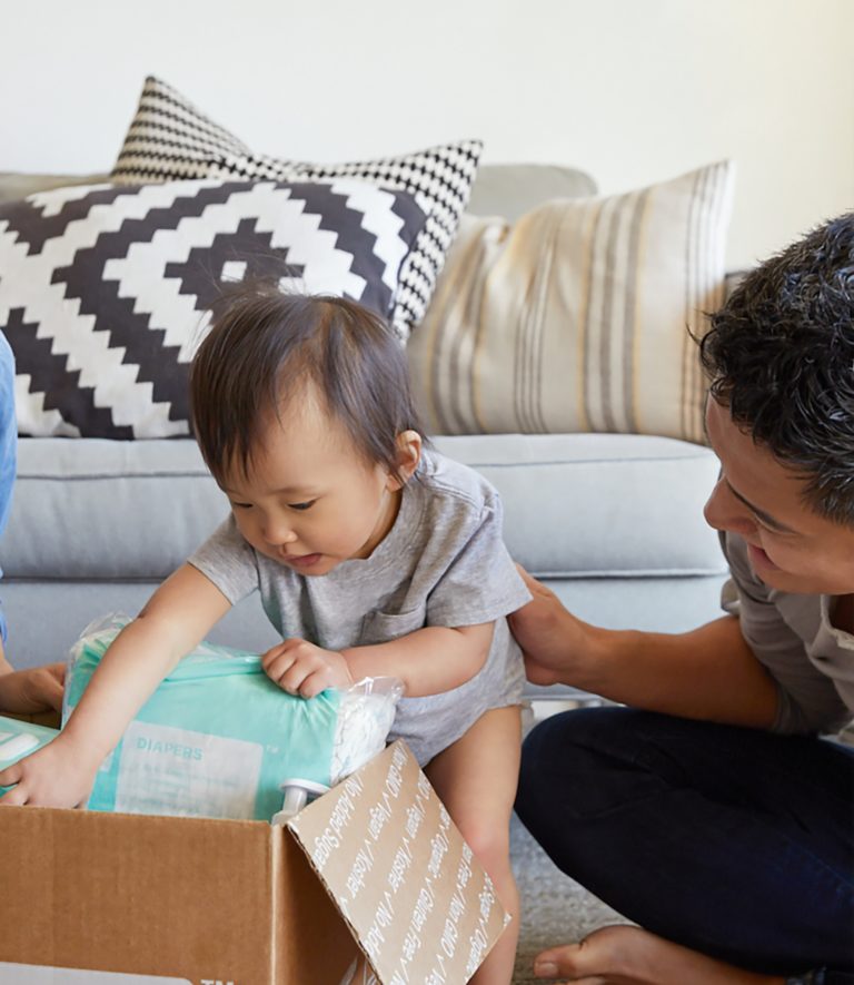 A baby opening a diaper bag