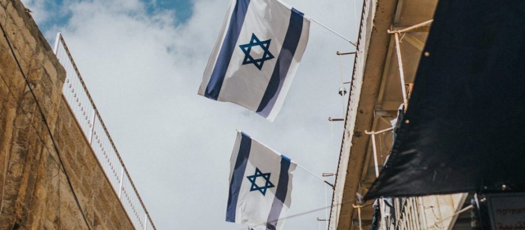 Two israeli flags flying high