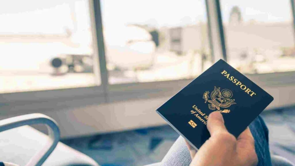 US passport in the airport being hold while waiting for L-1 visa processing time